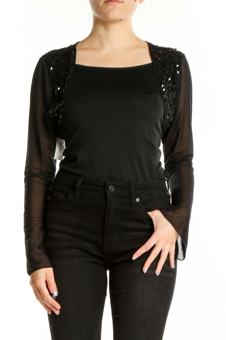 Front view of black sequined crop top with sheer sleeves