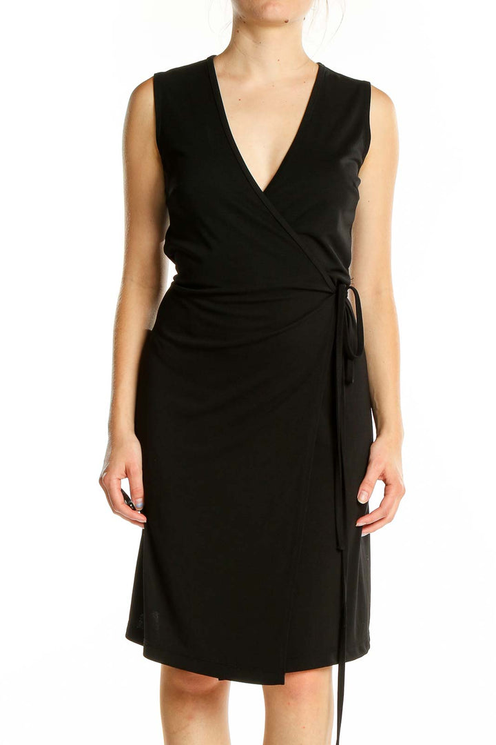 Front view of black wrap-style sleeveless dress from Express