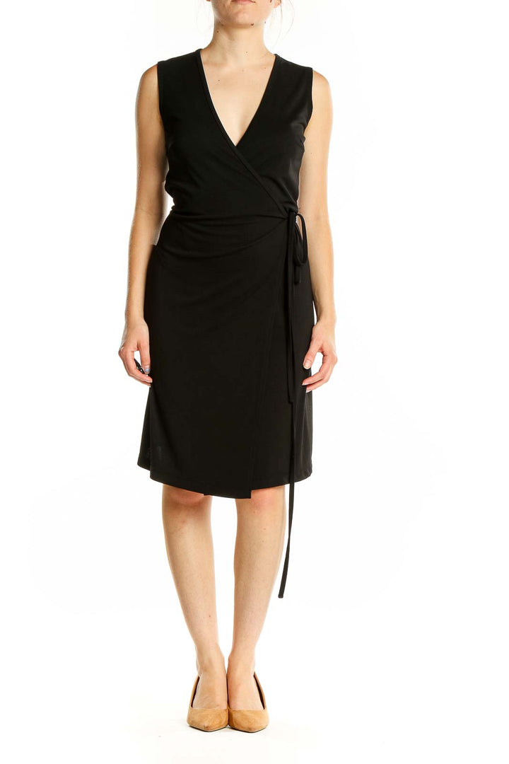 Front view of black wrap-style sleeveless dress from Express