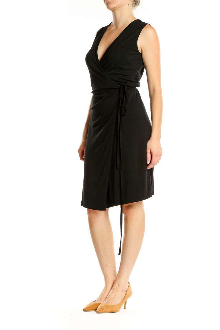 Front view of black wrap-style sleeveless dress from Express