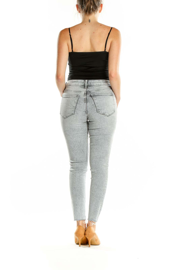 Back view of Gap light blue skinny jeans on model