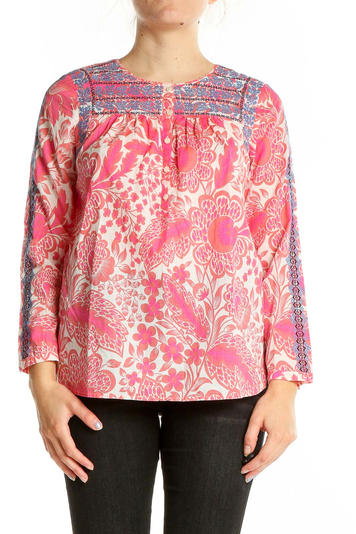 Front view of pink floral J.Crew cotton blouse with blue embroidery