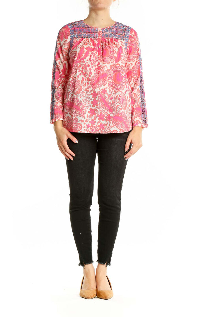 Front view of pink floral J.Crew cotton blouse with blue embroidery