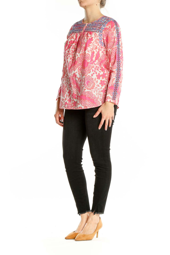 Front view of pink floral J.Crew cotton blouse with blue embroidery