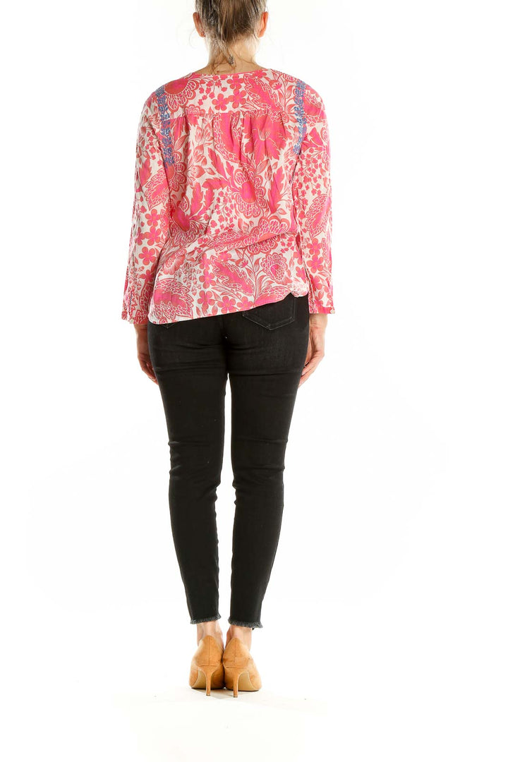 Back view of pink floral J.Crew cotton blouse showing relaxed fit