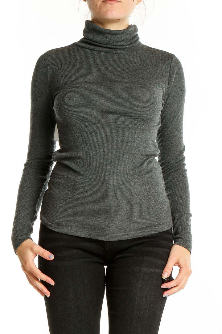 Front view of LOFT charcoal ribbed turtleneck sweater on model