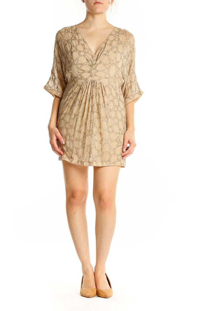 Front view of Needle & Thread beige mini dress with geometric embroidery