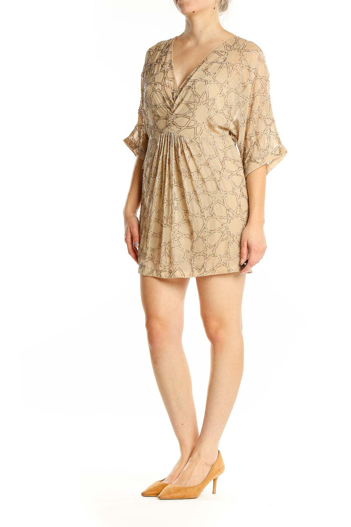 Front view of Needle & Thread beige mini dress with geometric embroidery