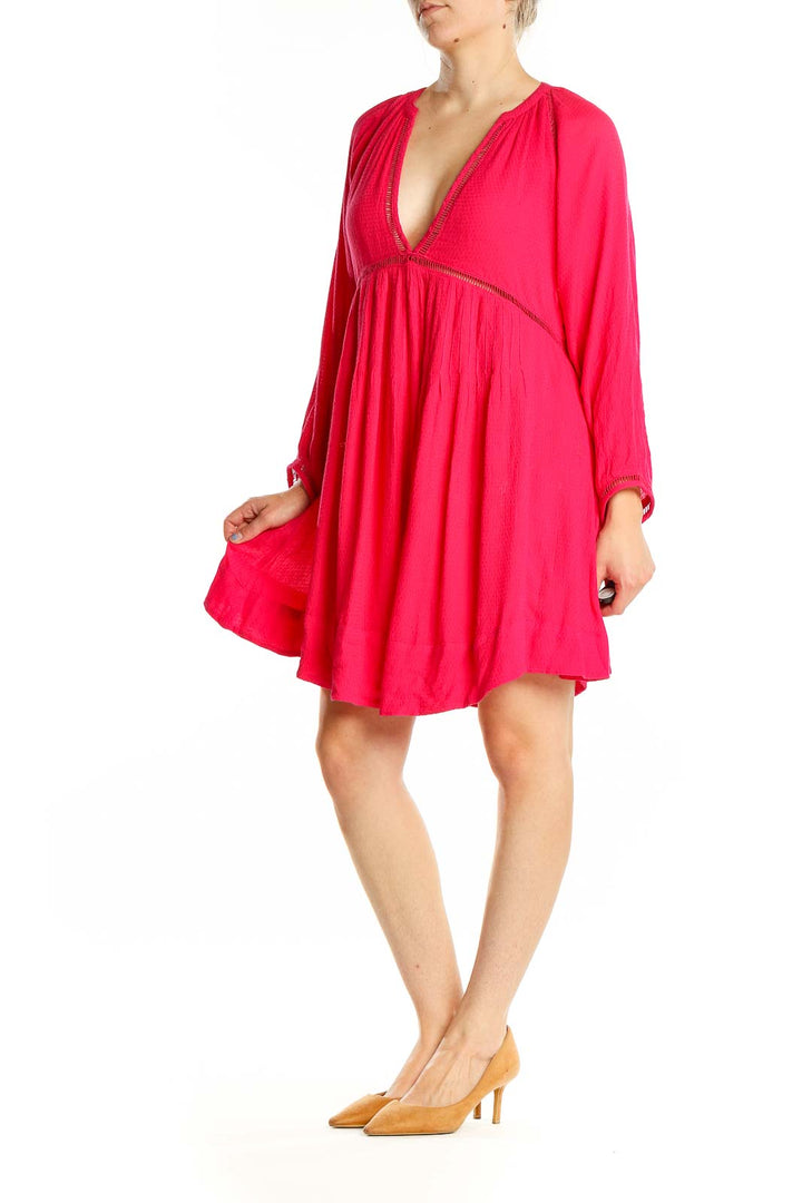 Front view of red flowy Free People boho mini dress with V-neckline