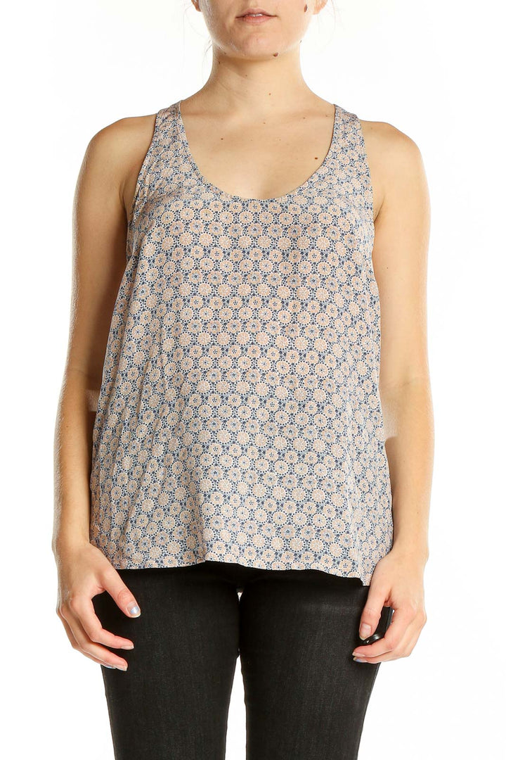 Front view of Joie beige silk tank top with blue floral print