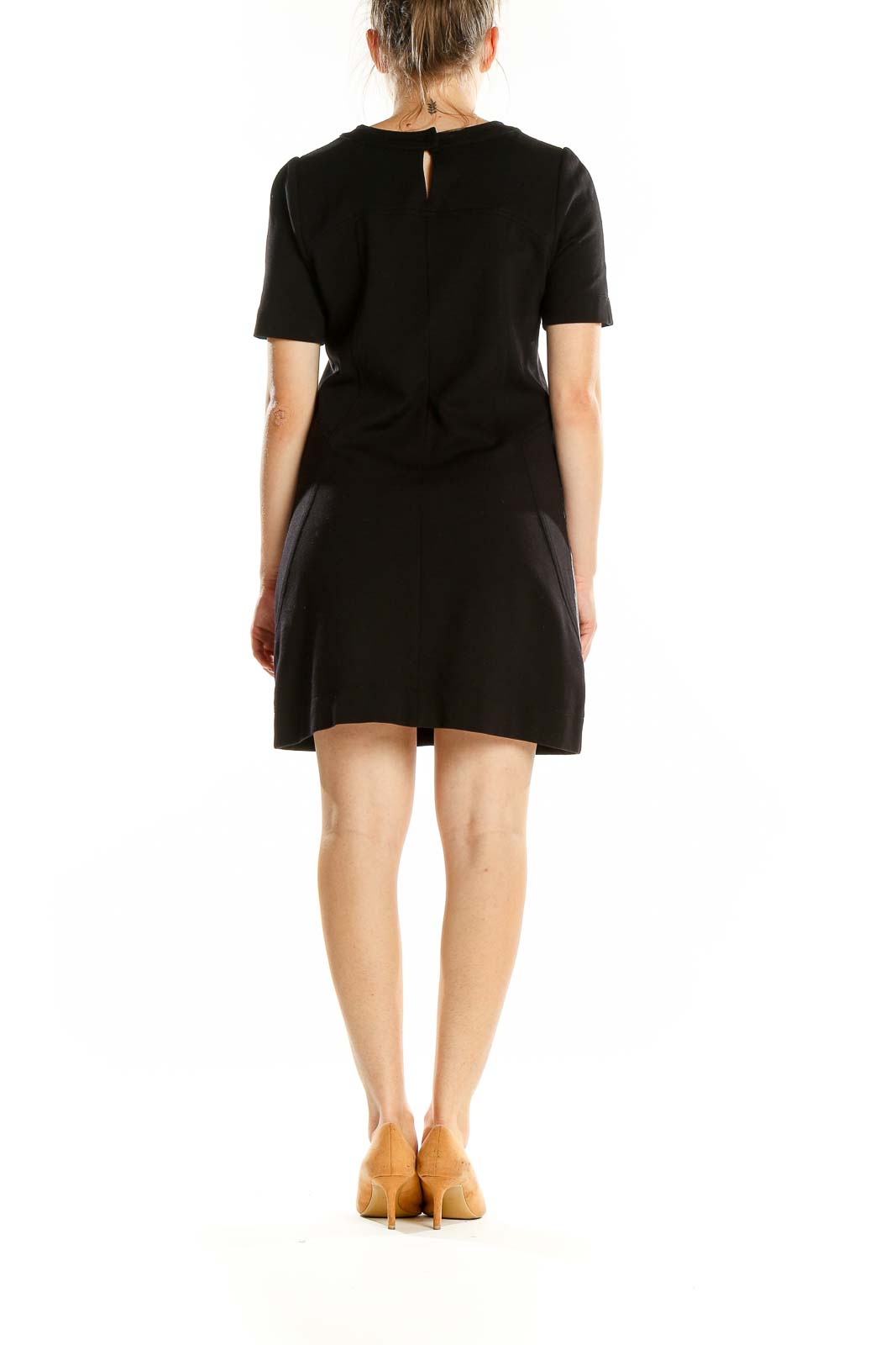 Back view of BCBG MaxAzria black mini dress showing keyhole detail