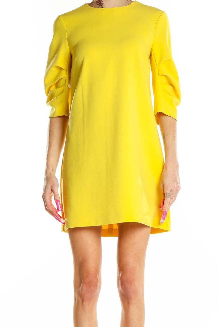 Front view of yellow Zara Woman mini dress with ruched sleeves