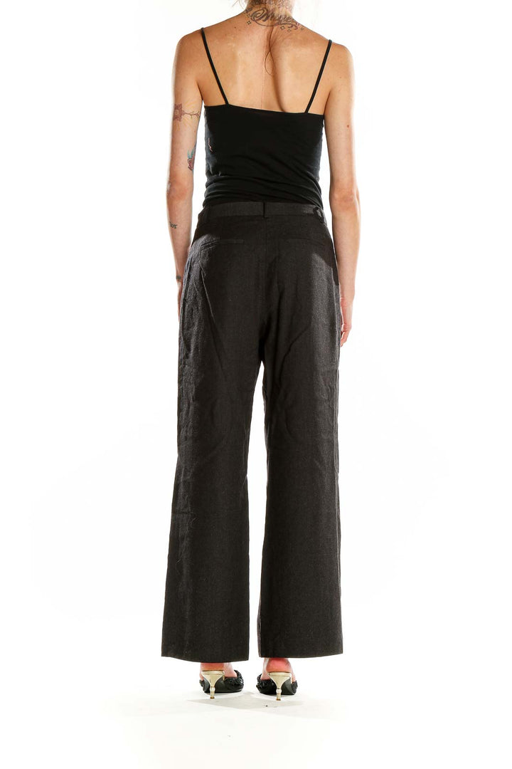 Side view of J.Crew black wide-leg trousers on model