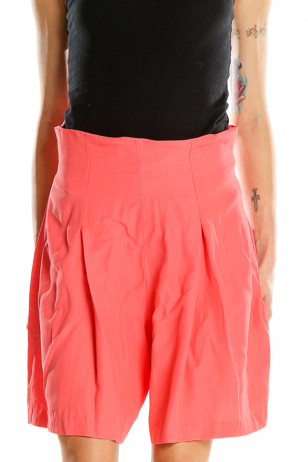 Front view of coral pleated RAMPAGE shorts