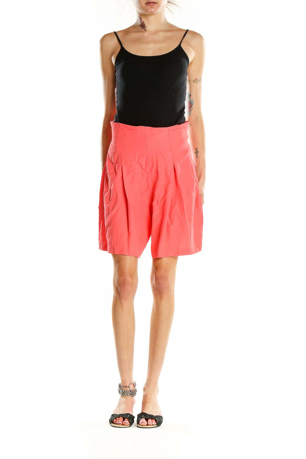 Front view of coral pleated RAMPAGE shorts