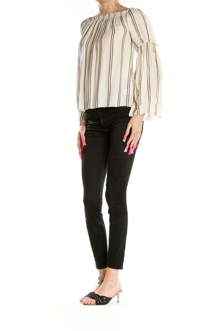 Front view of Chaser beige striped off-shoulder blouse with long bell sleeves