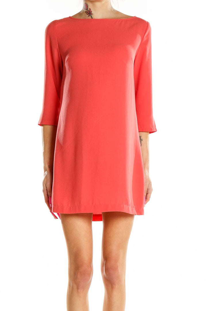 Front view of coral Leith shift mini dress with boat neckline