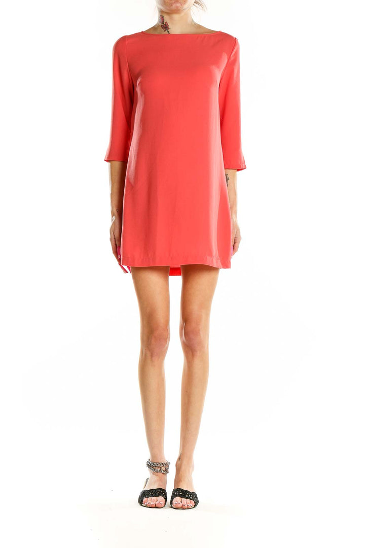 Front view of coral Leith shift mini dress with boat neckline