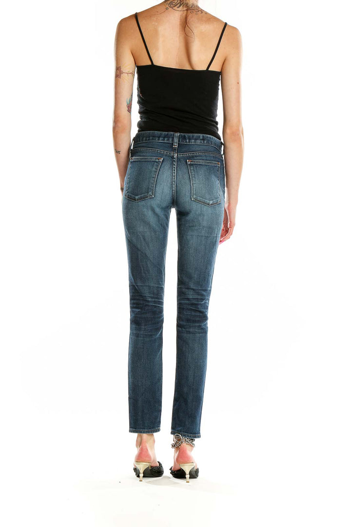 Back view of J.Crew blue straight leg jeans on model