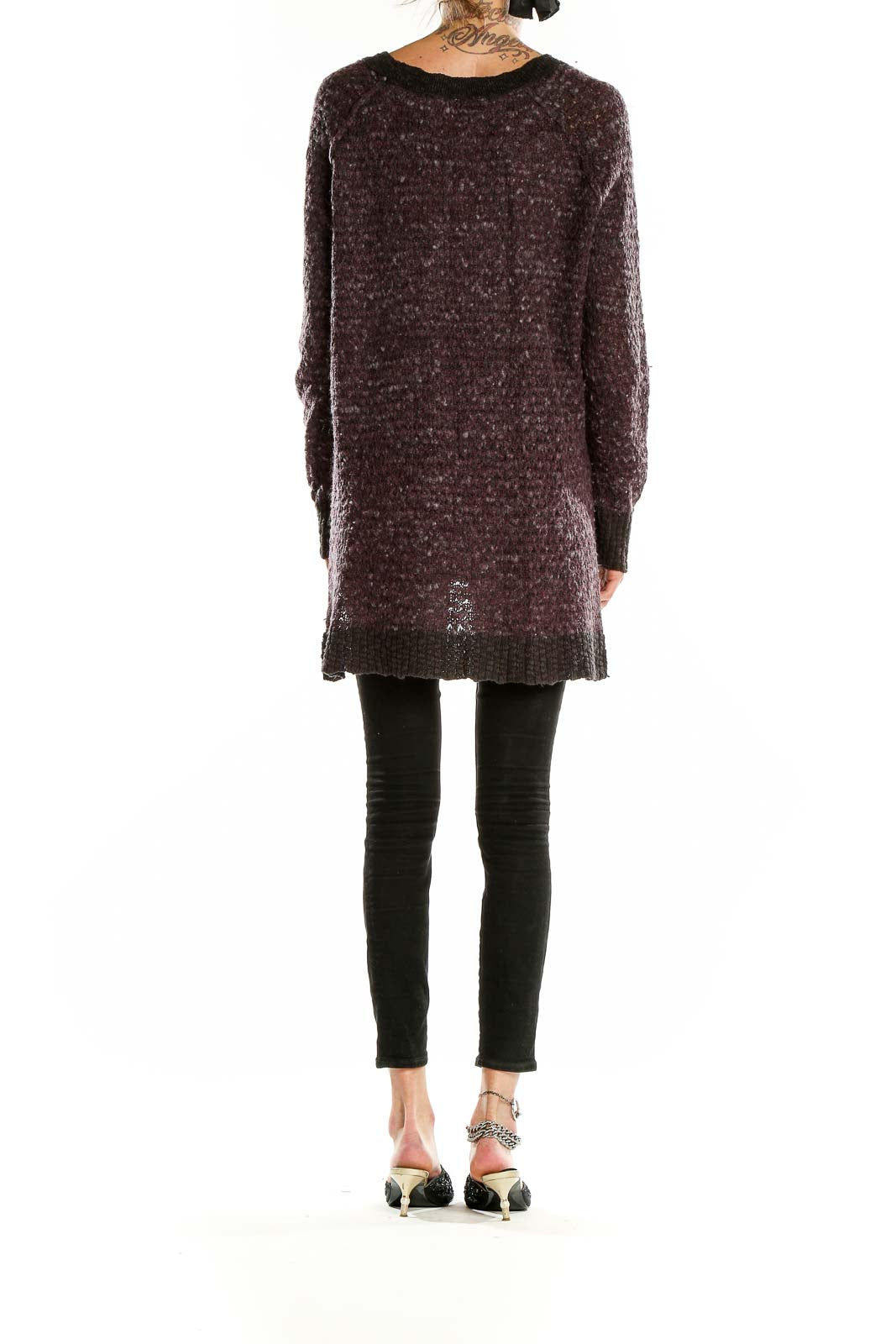 Back view of Free People brown textured oversized knit sweater showing high-low hemline