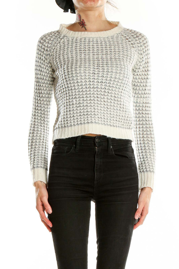 Front view of Joie white cropped knit sweater with metallic accents