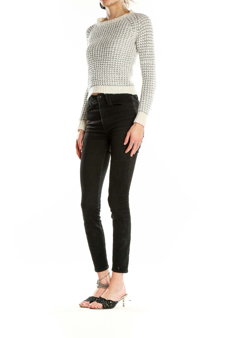 Front view of Joie white cropped knit sweater with metallic accents