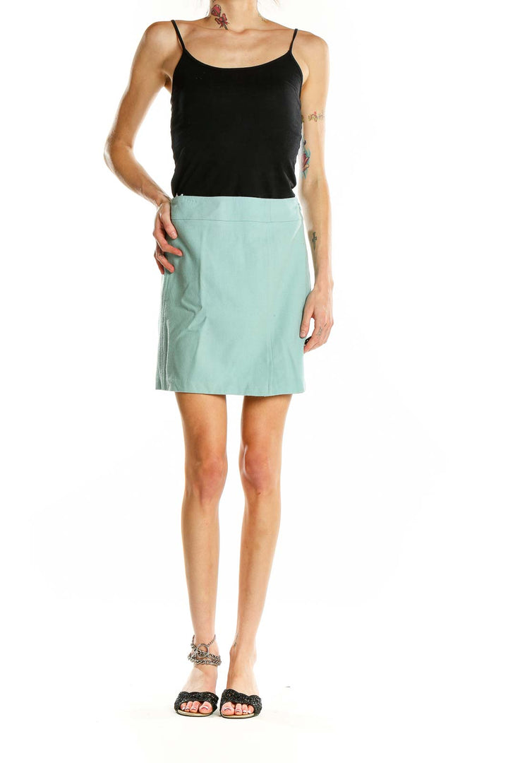 Front view of Gene Meyer mint green mini skirt on model