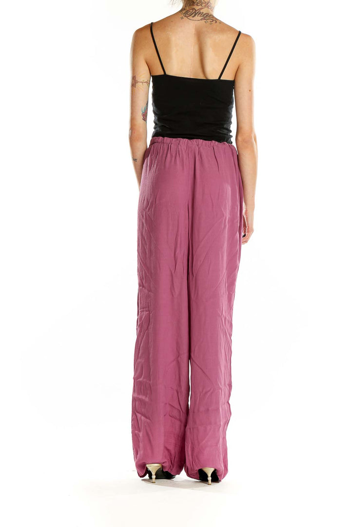 Side view of Kate Hill pink wide-leg rayon pants on model