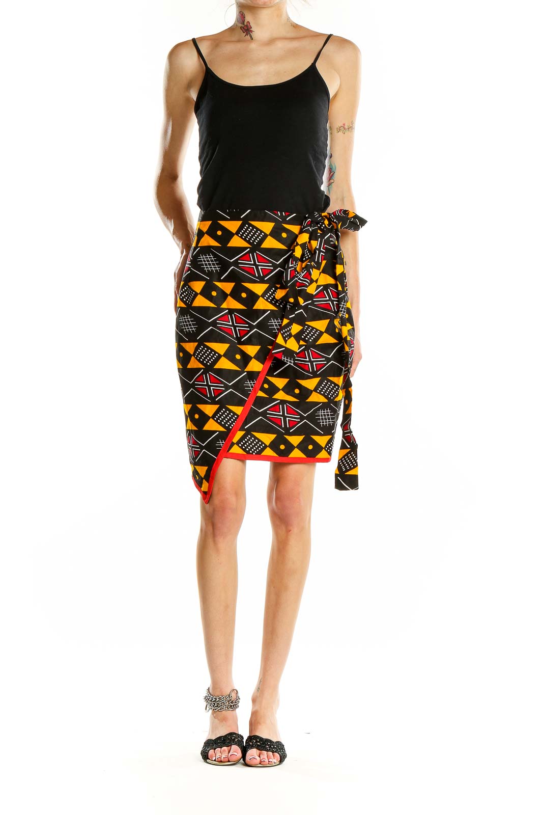 Front view of Heritage Clothing geometric print wrap skirt with black, orange, and red pattern