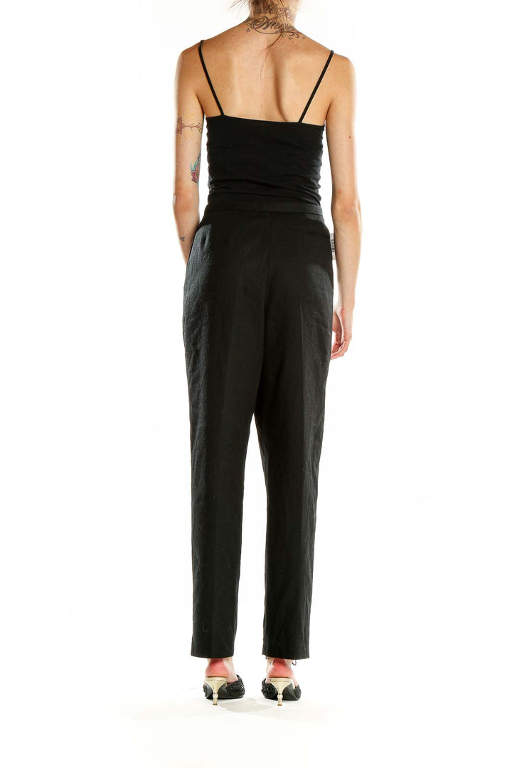 Side view of Harve Bernard black wool dress pants on model