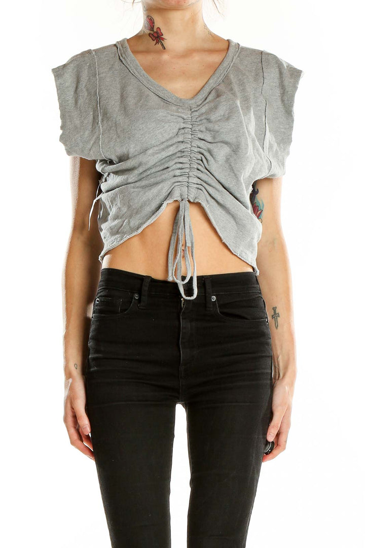 Front view of gray ruched V-neck crop top with drawstring detail