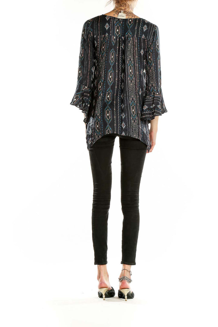 Side view of Haute Hippie black modal blouse showing asymmetrical hemline