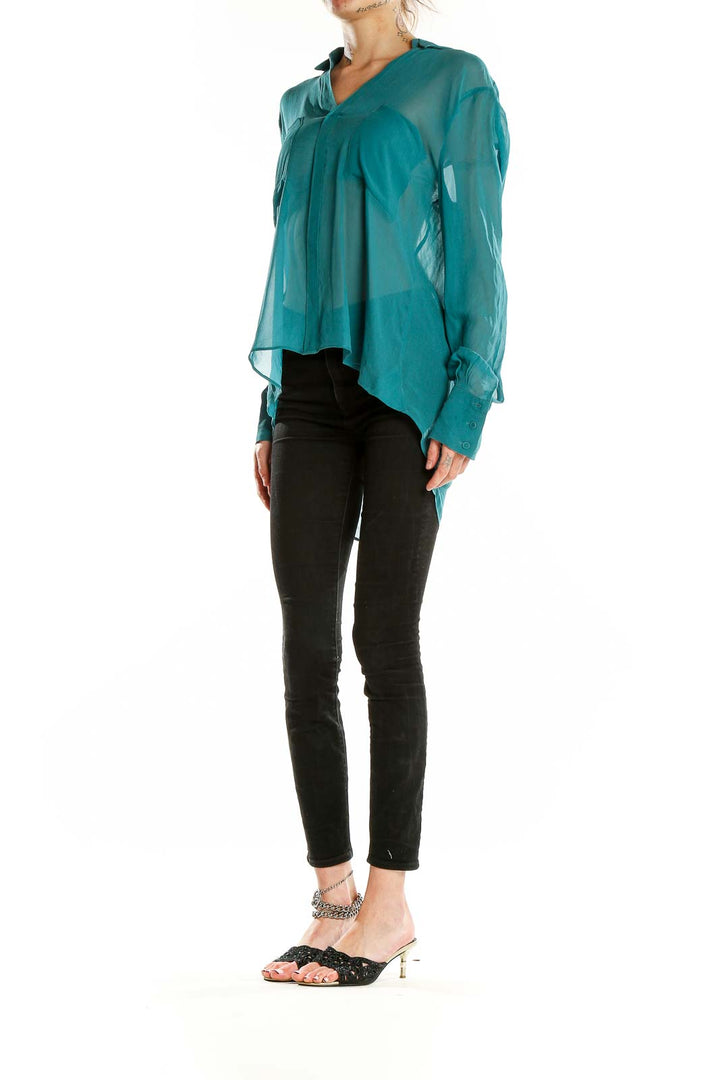 Front view of teal sheer silk blouse by BCBG MaxAzria with asymmetrical hem