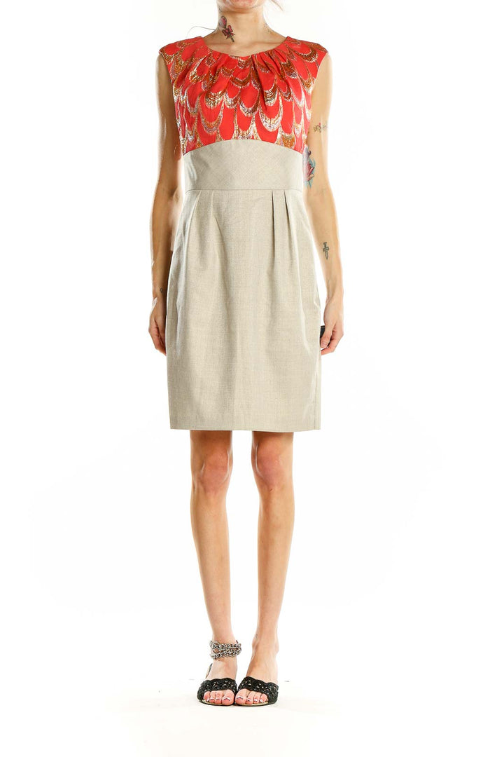 Front view of Trina Turk red feather print cocktail dress with beige skirt