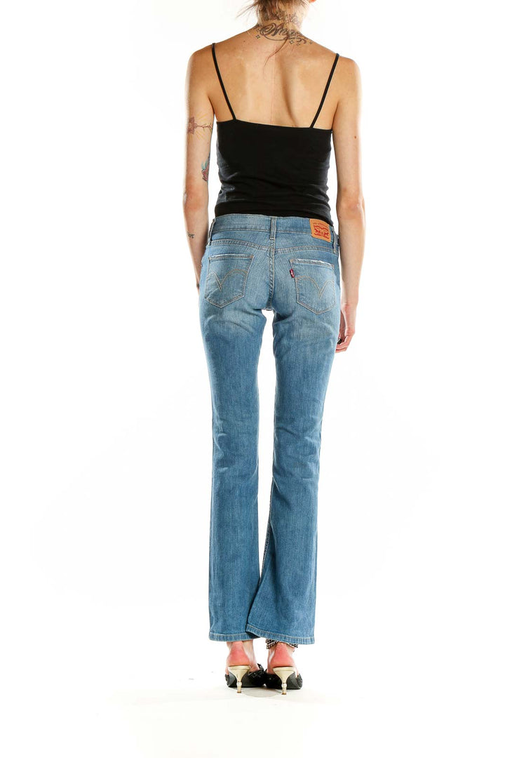 Back view of Levi's light blue bootcut jeans on model