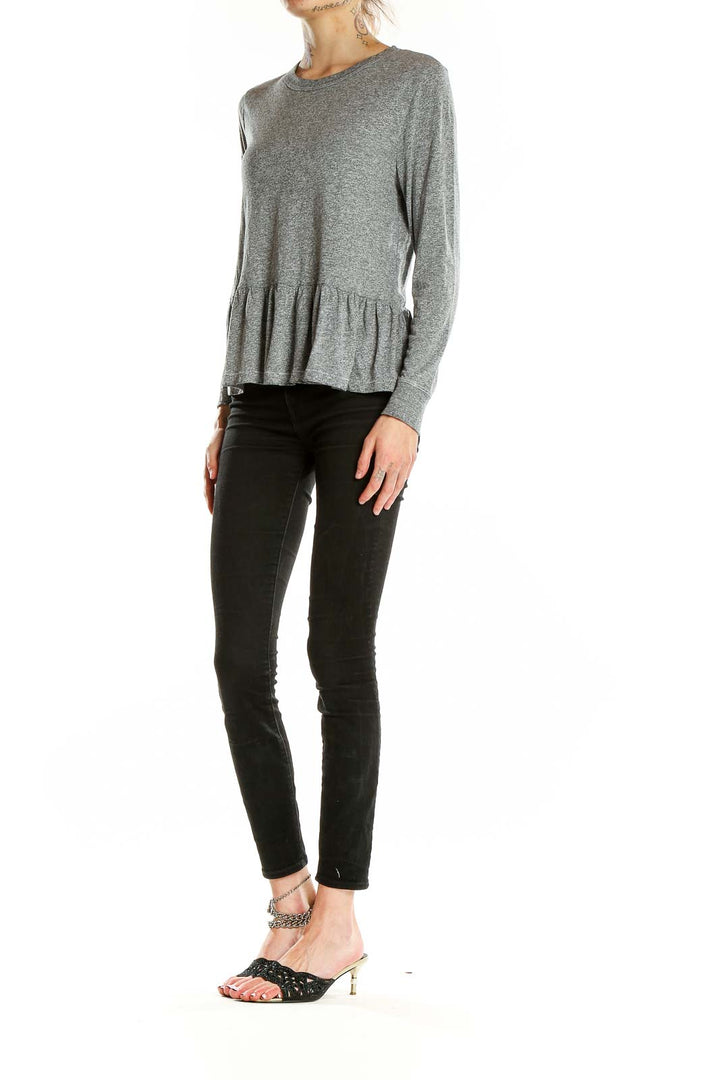 Front view of The Great gray peplum long sleeve top