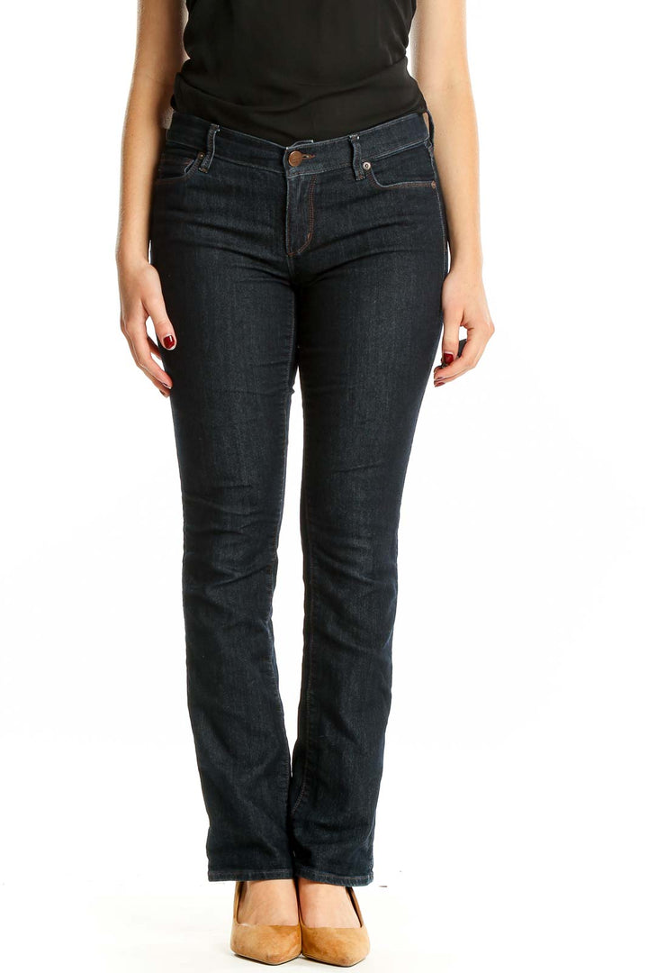 Front view of Ann Taylor LOFT dark blue bootcut jeans on model