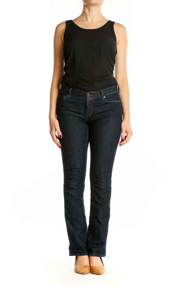 Front view of Ann Taylor LOFT dark blue bootcut jeans on model