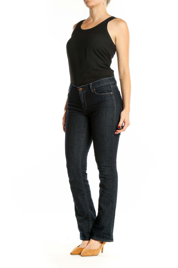 Front view of Ann Taylor LOFT dark blue bootcut jeans on model