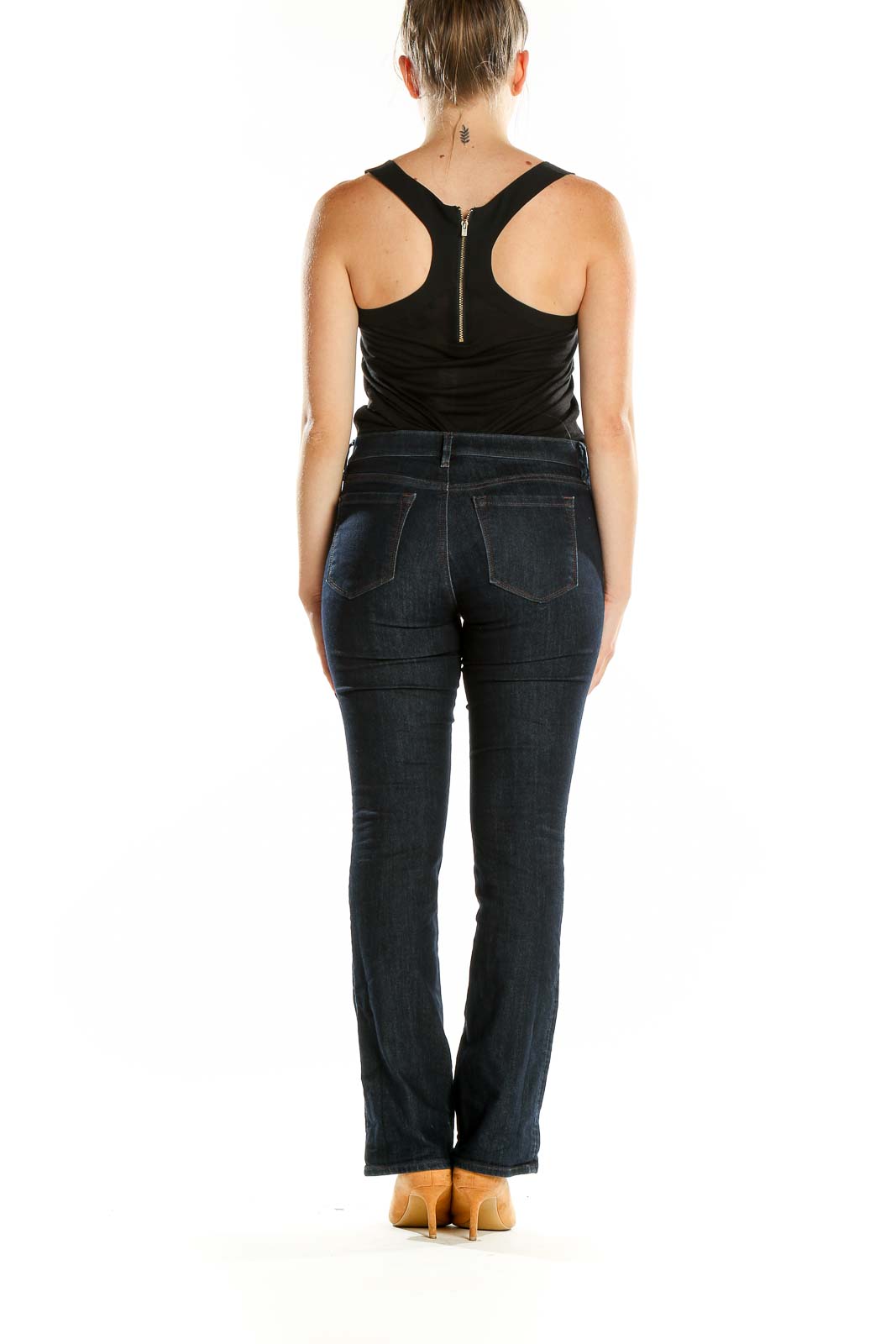 Back view of Ann Taylor LOFT dark blue bootcut jeans on model