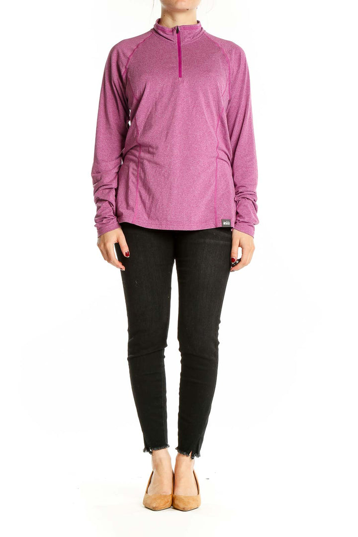 Front view of pink REI quarter-zip activewear top on model