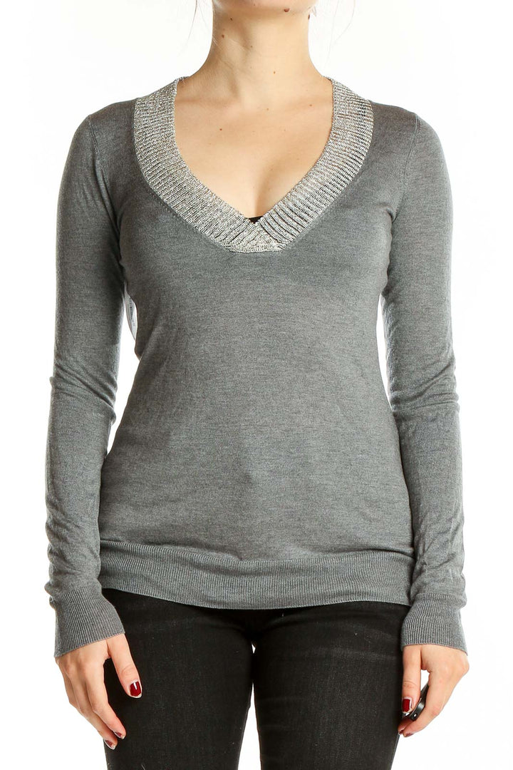 Front view of Martin + Osa gray V-neck long sleeve knit sweater on model