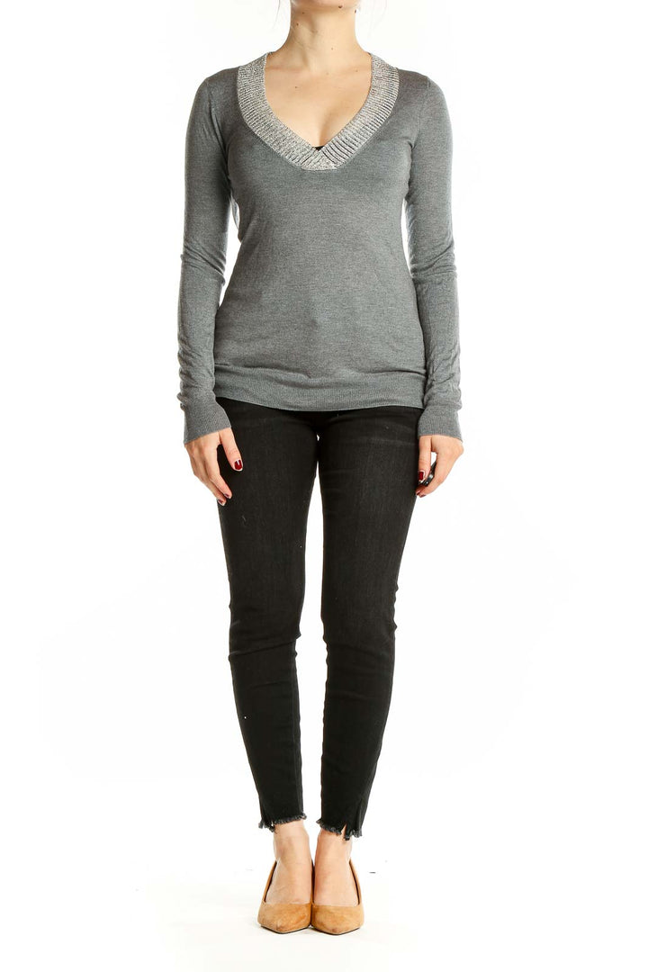 Front view of Martin + Osa gray V-neck long sleeve knit sweater on model