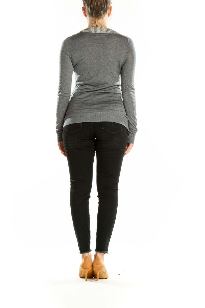 Back view of Martin + Osa gray V-neck long sleeve knit sweater on model