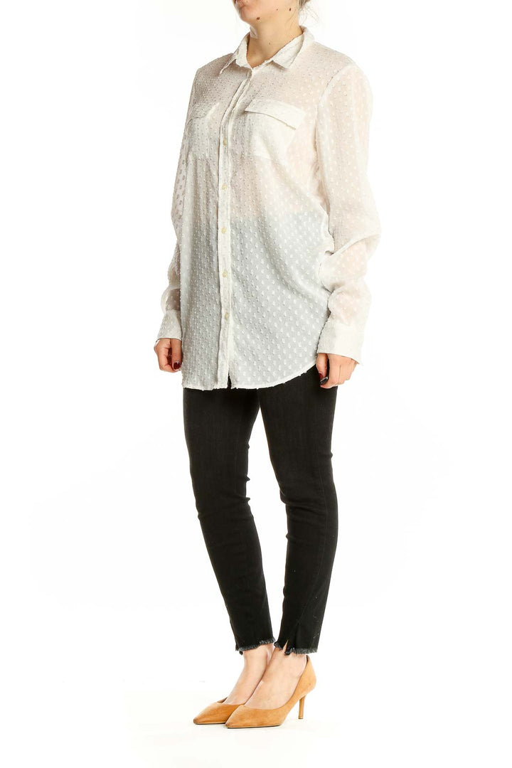 Front view of Banana Republic white sheer polka dot button-up blouse