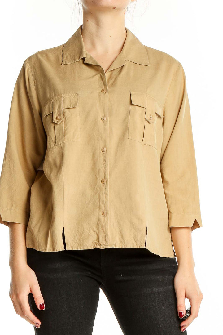 Front view of beige silk button-up blouse by Notations