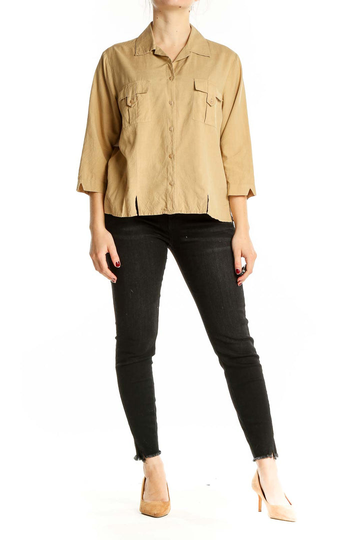 Front view of beige silk button-up blouse by Notations