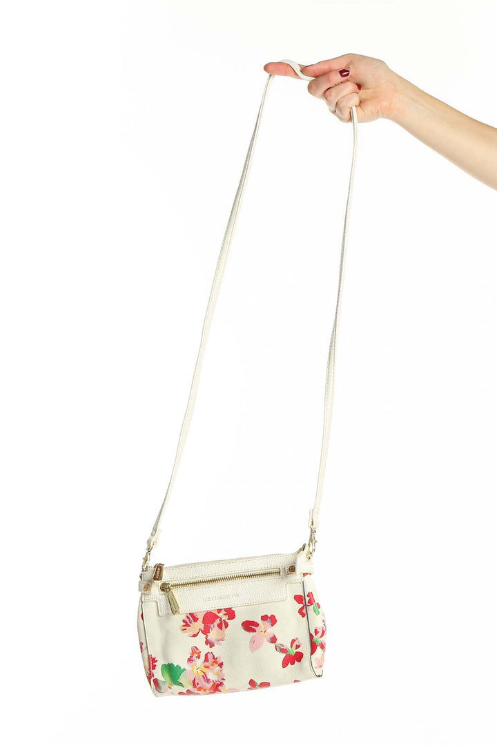 Front view of Liz Claiborne white floral print crossbody bag