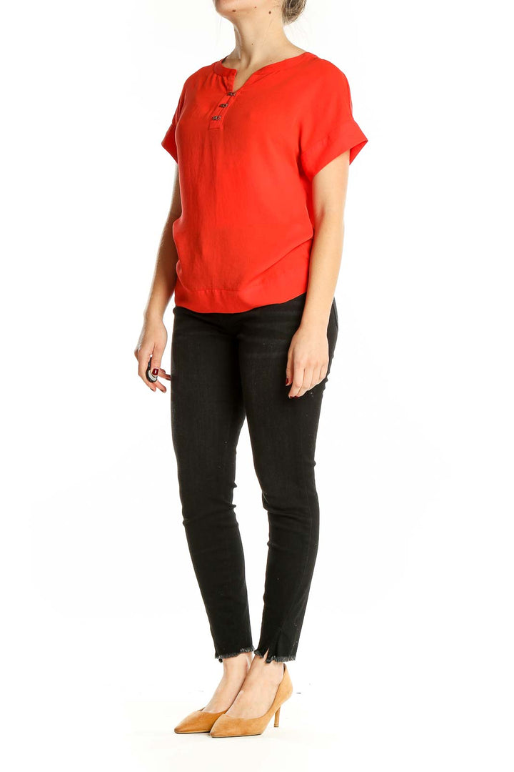 Front view of red short-sleeve Banana Republic blouse with henley neckline