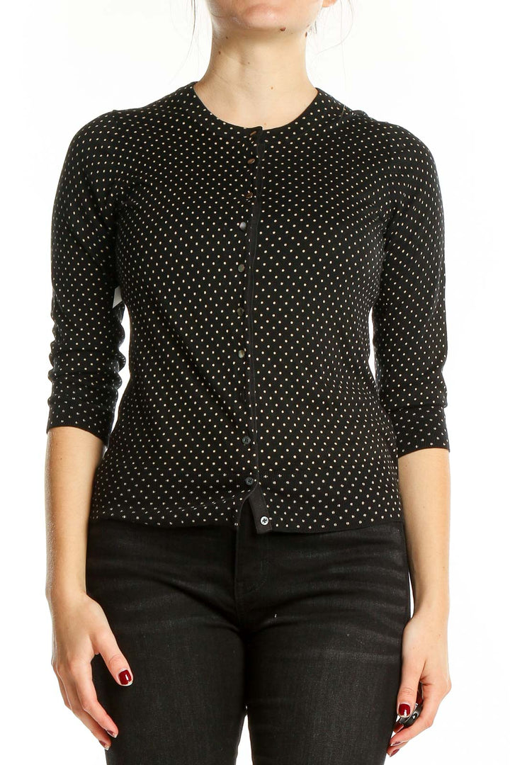 Front view of Banana Republic black polka dot cardigan with button-front closure